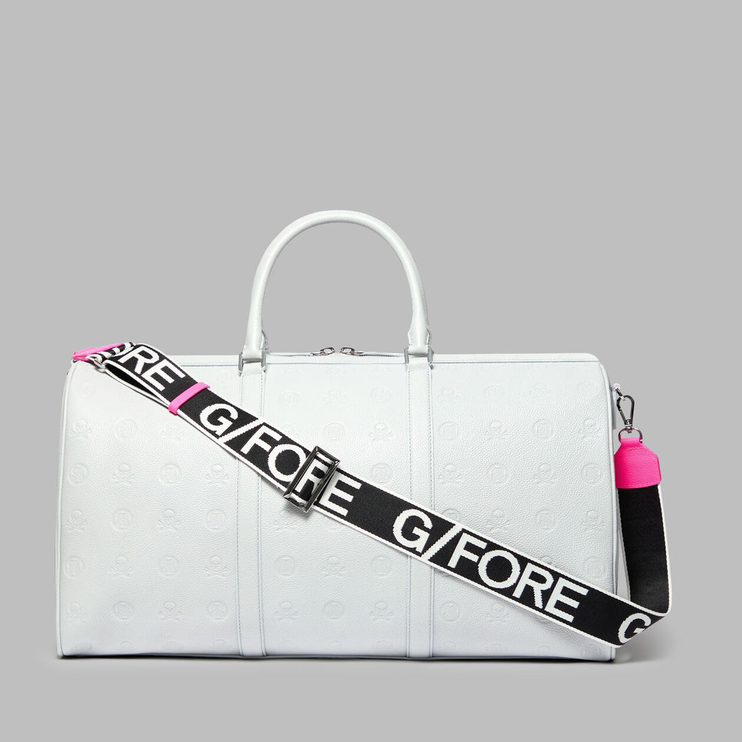 G/FORE EMBOSSED SKULL & TEES LEATHER WEEKENDER - NIMBUS