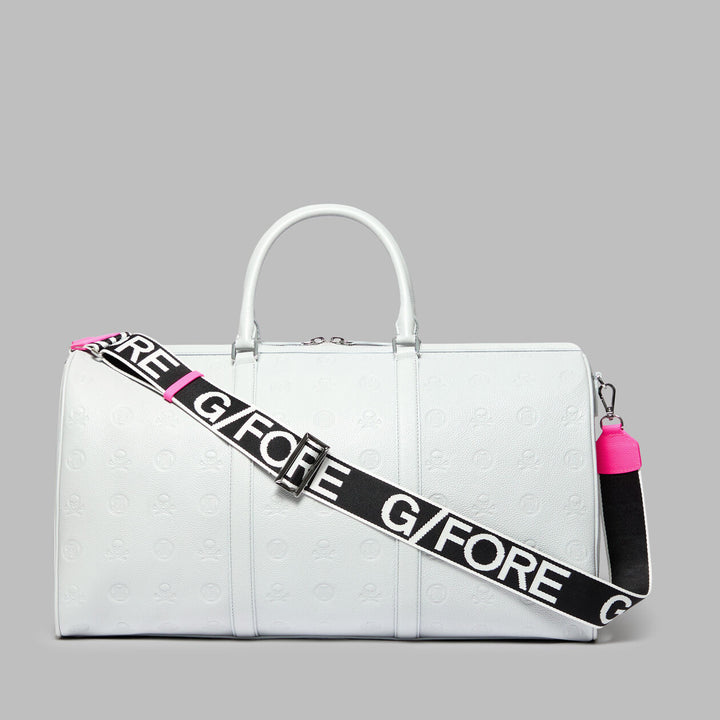 G/FORE EMBOSSED SKULL & TEES LEATHER WEEKENDER - NIMBUS